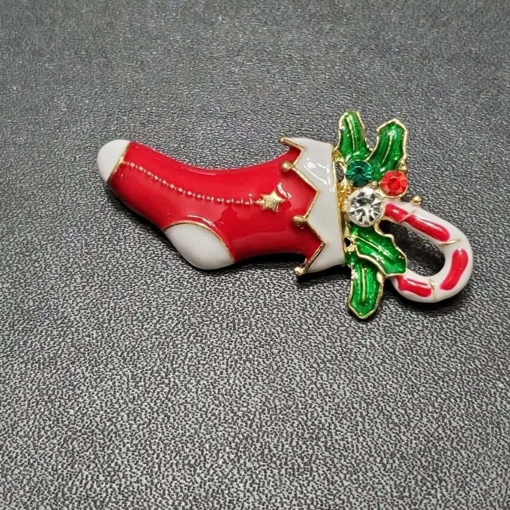 Gold tone holiday stocking filled with goodies red green white